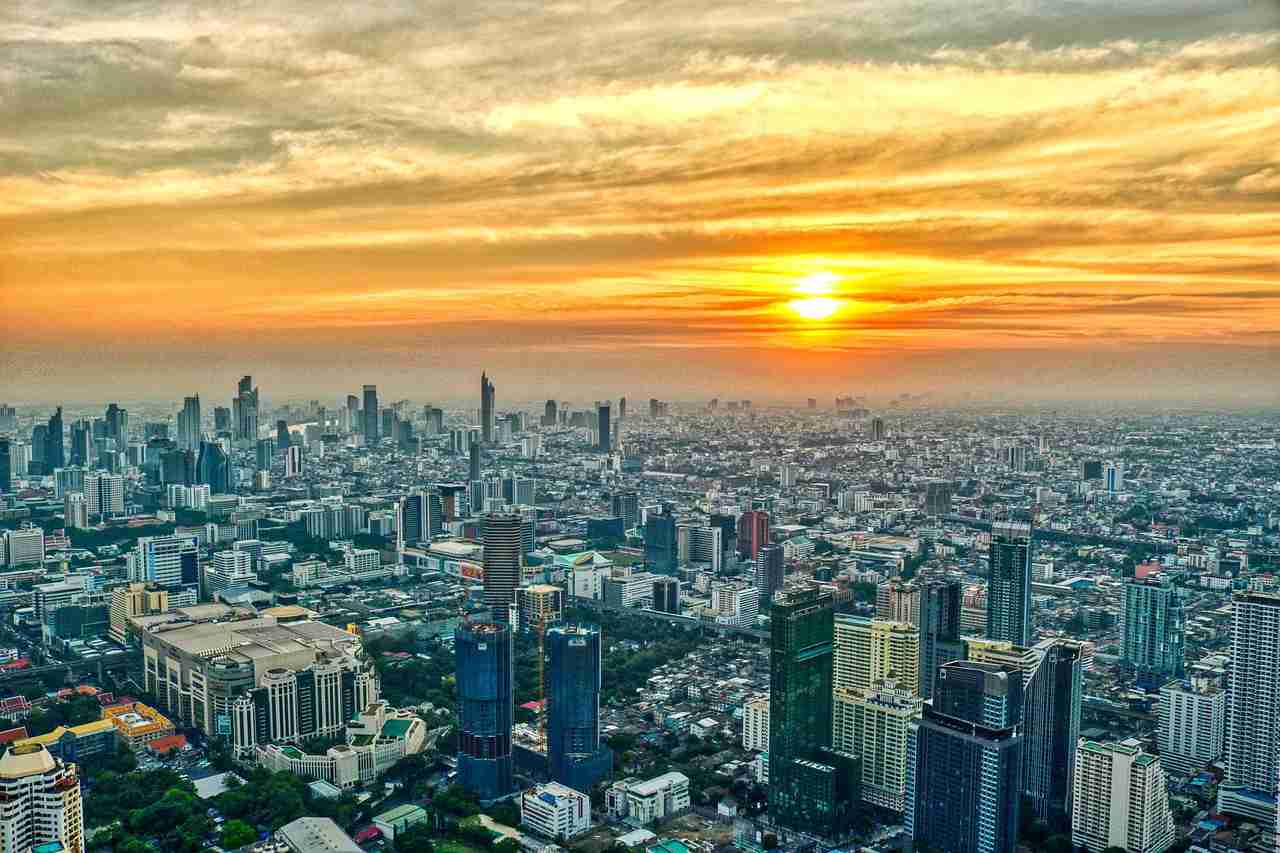 city buildings sunset sunlight 5697483